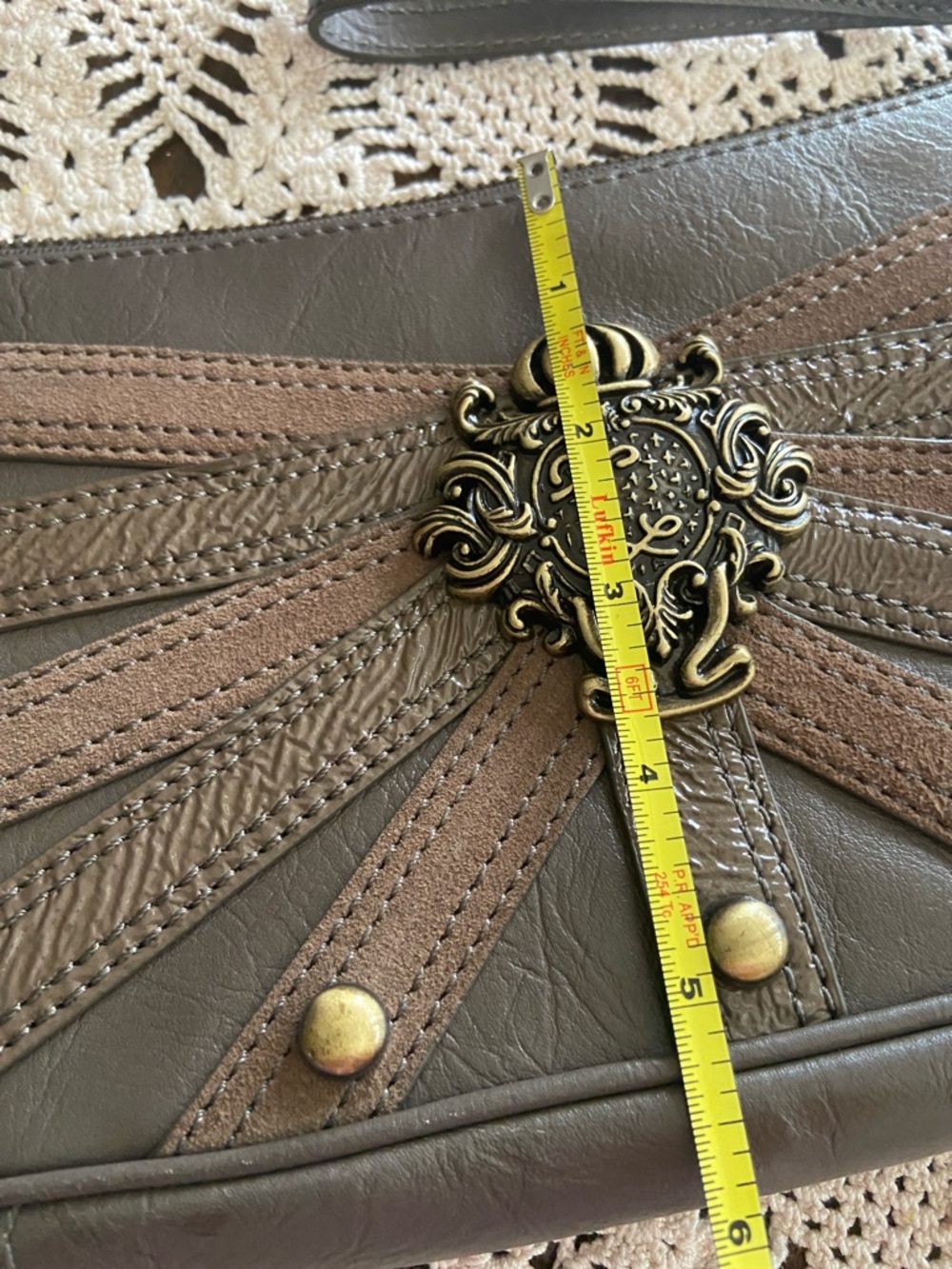 Kate Landry Brown and Taupe Decorative Crest Wristlet - Picture 6 of 6